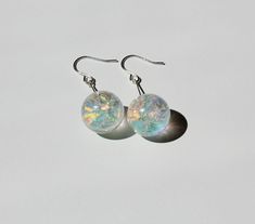 Dangle epoxy resin earrings with 16 mm rainbow sphere, ball earrings with rainbow fantasy shine. Perfect gift for her. Wedding and bridal earrings. Regenbögen ohrringe mit silber 925 Haken. More from APsoNice -https://www.etsy.com/shop/APsoNice Hypoallergenic Rainbow Round Earrings, Iridescent Round Jewelry With Ear Wire, Silver Round Resin Earrings, Handmade Iridescent Round Bead Earrings, Handmade Iridescent Earrings With Round Beads, Iridescent Ear Wire Earrings For Gift, Adjustable Iridescent Drop Earrings, Iridescent Dangle Resin Earrings, Nickel-free Iridescent Round Earrings