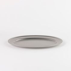 an empty metal plate on a white background