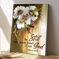 a wooden sign that says, be still and know that i am god with flowers on it