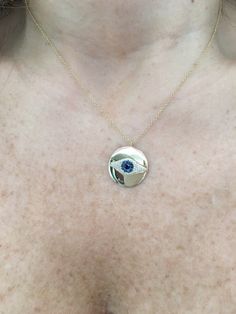 "14K Gold Diamond and Sapphire Evil Eye Necklace is beautifully set in a round 14k gold disk in the shape of an eye with 1 black diamond in the center. It's the perfect piece to have and never take off. The evil eye is believed to ward off an evil and bless the person wearing it! It comes on a 18\" 14k gold chain, but I put an extra loop at 17\" and 16\" so that you can wear it at any of those lengths. Great gift for bridesmaids, birthdays, graduation, or any other special occasion! -46 Diamonds Yellow Gold Medallion Jewelry With Evil Eye, Yellow Gold Jewelry With Evil Eye Medallion, Yellow Gold Evil Eye Jewelry For Anniversary, Yellow Gold Evil Eye Medallion Jewelry, Yellow Gold Round Pendant Jewelry With Diamond Eyes, Yellow Gold Round Jewelry With Diamond Eyes, Gold Round Evil Eye Jewelry, Gold Evil Eye Round Jewelry, Anniversary Round Necklaces With Diamond Eyes