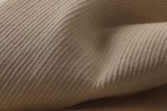 close up view of the texture of a knitted fabric, which is soft and warm