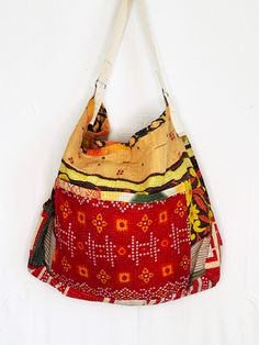 Voluminous enough to hold all your necessities our vintage Kantha Beach Bazaar Bag is the perfect companion for a day at the beach, strolling through the farmer’s market, sleepovers and of course, travel. Twisted Guru Bazaar Bags come in a wide variety of prints and patterns making accessorizing your outfit easy and fun! Product Details: Handcrafted One-of-a-Kind Multi Patterns. Two-(2) handbags are cut from the same cloth. They are similar but different, so please note that your handbag may be Eco-friendly Multicolor Festival Bag, Vintage Tote Hobo Bag For Travel, Beach Patchwork Tote Bag, Beach Tote Bag With Patchwork, Multicolor Large Capacity Hobo Bag For Beach, Multicolor Patchwork Shoulder Bag For The Beach, Vintage Multicolor Patchwork Shoulder Bag, Summer Patchwork Shoulder Bag, Multicolor Rectangular Hobo Bag For Vacation