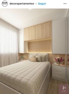 an image of a bedroom setting with white furniture