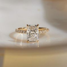 an engagement ring with a princess cut diamond