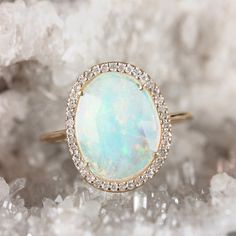 "\"Details: Item code :- ATR-2382 - 14K yellow solid gold (as shown) wt :1.26 gm - 0.16 ct diamonds - 1.15 ct opal - Ring size 16x13 mm & ring size 7 us Anjis touch jewelry supports ethical and eco-friendly practices and uses reclaimed and recycled metals whenever possible About my jewelry: All of the Anjis touch jewelry collection is handmade exclusively by me.  I hope that you will enjoy wearing my designs as much as I enjoy making them! Shipping: We have this in stock which we can ship in 2-3 14k Yellow Gold Opal Ring With Halo, Fine Jewelry Opal Ring With Halo In 14k Gold, Gold Opal Ring With Halo Design In 14k Gold, 14k Gold Opal Ring With Halo Setting, Oval Opal Ring With Halo Setting In 14k Gold, Oval Opal Halo Ring In 14k Gold, Yellow Gold Opal Ring With Halo, 14k Gold Opal Ring With Halo Design, Heirloom Opal Ring With Halo Setting In 14k Gold