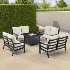 an outdoor seating set with fire pit