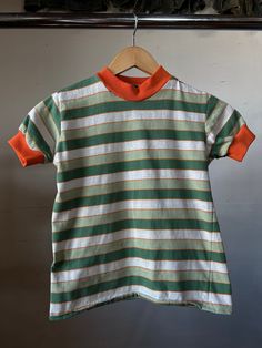 "1970s striped t-shirt  15\" Pit to Pit  18\" Length All sales final, please ask any questions before buying - Thanks!" Retro Striped Short Sleeve T-shirt, Green Short Sleeve T-shirt With Three Stripes, Multicolor Short Sleeve Top With Striped Collar, Multicolor Short Sleeve Tops With Striped Collar, Green Crew Neck T-shirt With Contrast Stripes, Vintage Striped Short Sleeve T-shirt, Vintage Striped Cotton T-shirt, Green Short Sleeve T-shirt With Contrast Stripes, Green Short Sleeve Tops With Contrast Stripes