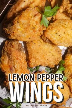 lemon pepper wings with parsley on top and the words lemon pepper wings above it