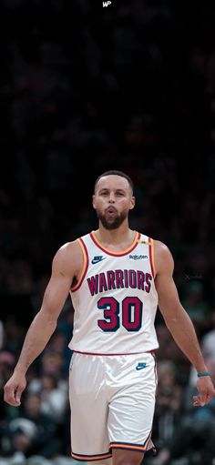 a basketball player is standing on the court