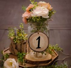 there is a vase with flowers in it and a number one sign on the front