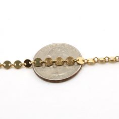 Flat round disk coin chain, perfect for chokers or dainty bracelets. Quantity : 1 foot Material : Sterling silver or 14K gold filled Dimension : Width of discs are 4mm and thickness of disc is 0.5mm. Surface : shiny gold or shiny silver Finished: No Standard necklace size is 16 inches Link to our clasp: https: //etsy.me/33C2gG5 Link to our jump ring: https://etsy.me/3a4DfVa All chain is final sale | no refunds or exchanges Please ask for larger quantities if would like more than what is currentl Gold Nickel-free Chain Bracelet, Permanent Jewelry, Bracelet Chain, Dainty Bracelets, Necklace Size, Shiny Silver, Necklace Sizes, Jump Rings, Final Sale