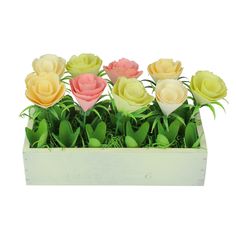 there are many different colored flowers in the box