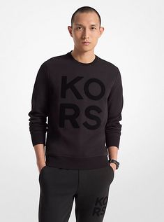 Cut from a cotton-blend knit and made to layer, this sweatshirt offers a signature statement for the weekend. “KORS” lettering in velvet adds tactile contrast, while the fit keeps it refined. Team it with the coordinating joggers for a sporty weekend look. Black Long Sleeve Sweatshirt With Logo Lettering, Black Long Sleeve Sweatshirt With Logo, Black Sweatshirt With Logo Lettering For Fall, Black Top With Logo Lettering For Winter, Black Tops With Logo Lettering For Winter, Black Logo Lettering Top For Winter, Casual Black Sweatshirt With Logo Lettering, Cotton Tops With Logo For Loungewear, Winter Athleisure Sweatshirt With Logo