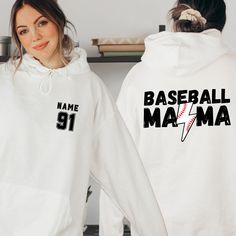 Elevate your game day style with our Custom Baseball Mom Hoodie. This isn't just any sweatshirt - it's a personalized tribute to the love and support you show as a baseball mom. Whether it's for Mother's Day or any day, this custom gift is a home run. Featuring your chosen name and number, it's a one-of-a-kind expression of your pride. Stay cozy and stylish on the sidelines or in the stands with this must-have baseball mom sweater. Order yours today and wear your support with pride! Welcome to V Sports Team Logo Hoodie For Sports Season, White Fan Apparel Hoodie For Sports Events, White Hoodie With Team Logo For Streetwear, Throwback Hoodie For Sports Season Fan Merchandise, White Team Spirit Hoodie For Streetwear, Sports Season Fan Merchandise Hoodie Tops, Sports Fan Apparel Hoodie Sweatshirt, Sports Events Team Logo Hoodie, White Fan Apparel Hoodie For Sports