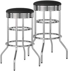 two metal stools with black cushions on them