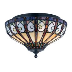 a stained glass ceiling light hanging from the ceiling