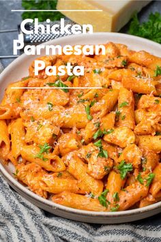 chicken parmesan pasta in a white bowl with parsley on top and the words chicken parmesan pasta above it