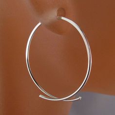 Handmade Stylized Oval Hoops by Cecile Stewart Jewelry -choose from a variety of metals that are all hypoallergenic and nickel free -metal choices are sterling silver, low tarnish argentium sterling, 14kt yellow gf, 14kt rose gf, grey niobium -earrings made to your size desire -select size in drop down menu -choose from 1 inch to 2 1/2 inches -fits standard piercings -nickel free -pair -lightweight -twist to the side to open -photos are on a mannequin and are of 1 inch earrings These earrings ar Minimalist Metal Hoop Earrings With Polished Finish, Minimalist Hoop Jewelry As Gift, Minimalist Hoop Jewelry Gift, Simple Hoop Jewelry For Everyday, Everyday Simple Hoop Jewelry, Simple Small Hoop Nickel-free Jewelry, Simple Nickel-free Small Hoop Earrings, Minimalist Metal Hoop Earrings, Simple Nickel Free Small Hoop Jewelry