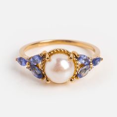 14k Vintage Inspired Pearl and Tanzanite Statement Ring | Local Eclectic Tanzanite Ring Vintage, Diamond Gold Wedding Rings, Sapphire Pearl Engagement Ring, Vintage Wedding Rings Pearl, Vintage Blue Engagement Rings, Coloured Engagement Rings Vintage, Sapphire And Pearl Ring, Vintage Engraved Sapphire Ring, Timeless Rings Engagement