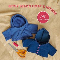 the baby's coat and hoodie are made out of blue material, with scissors next to it