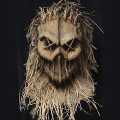 an old mask with grass on it and the words click image to see more information