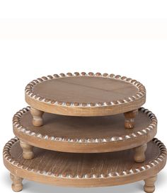 three wooden trays stacked on top of each other with beaded trim around the edges