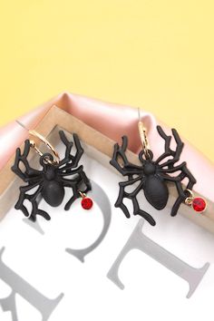 How fun is this spider for Halloween spider earrings. This will be perfect on your Halloween costume.matching necklace: 10N3060102DIMENSION length: 1.75"width: 1" earring back: Postmetal finish: Gold Platingproduct: Lead & Nickel Compliantanti-tarnish: Double E-coating Black Spooky Jewelry For Party, Spooky Black Jewelry For Party, Black Novelty Jewelry For Party, Novelty Black Jewelry For Party, Black Spooky Party Jewelry, Spooky Black Jewelry For Halloween, Black Halloween Party Earrings, Spooky Black Halloween Jewelry, Spooky Black Earrings For Party