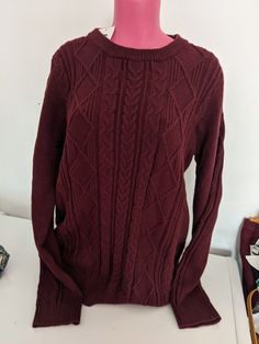 Elevate your wardrobe with this stylish sweater from PrettyGuide. The cable-knit design adds texture and interest to this burgundy pullover, which features a classic crew neck and long sleeves. The sweater is made from a cozy knit fabric that includes polyester, nylon, and viscose for a comfortable fit. This top is perfect for any casual occasion and can be paired with jeans or leggings for a complete look. The size of this sweater is Large and it is suitable for regular size types. With its elegant design and high-quality fabric, this sweater is a must-have addition to your wardrobe. Red Cable Knit Tops, Cozy Burgundy Winter Sweater, Burgundy Sweater Drown Tightw, Red Cable Knit Crew Neck Top, Cozy Burgundy Knit Sweater, Burgundy Knit Sweater, Stylish Sweater, Knit Long Sleeve, Fall Sweater