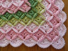 a crocheted dishcloth on a wooden table