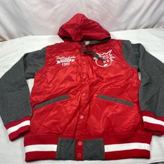 Brand New In With Tags The Hundreds X Drawing Lines Reloaged Sp 13 Varsity Jacket Size: Men's Medium Features: Vintage Letterman Retro Sport Styling Snap Front Closure Red Body With Grey Fleece Sleeves Adjustable Red Hood With Gray Fleece Lining And Drawstrings Embroidered White Adam Bomb Left Chest The Hundreds Drawing Lines 1980 Text Right Chest Huge Text In Rear 2 Front And 1 Inner Right Side Pockets Red & White Striped Rib Knit Cuffs And Hem Charcoal Lining Questions? Leave A Comment Below! Sporty Nylon Varsity Jacket For Winter, Red Nylon Hooded Track Jacket, Red Nylon Hooded Jacket For Fall, Winter Nylon Varsity Jacket With Long Sleeves, Winter Long Sleeve Nylon Varsity Jacket, Red Varsity Sports Outerwear, Red Hooded Cotton Varsity Jacket, University Red Hooded Winter Outerwear, Hooded Red Cotton Varsity Jacket