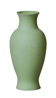 a light green vase sitting on top of a white table