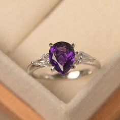 Teardrop Amethyst Ring For Anniversary, Elegant Teardrop Amethyst Ring, Purple Teardrop Amethyst Ring For Anniversary, Elegant Pear-shaped Amethyst Promise Ring, Pear-shaped Purple Amethyst Ring With Prong Setting, Purple Pear-shaped Amethyst Ring With Prong Setting, Elegant Teardrop Amethyst Gemstone Ring, Elegant Teardrop Purple Amethyst Ring, Elegant Purple Teardrop Amethyst Ring