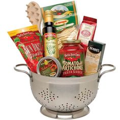 a silver colander filled with food and condiments