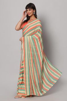 This striped pastel yellow, green, and coral saree is a festive stunner! The sequin work on this saree gives the perfect amount of shine and glam to it - Pair this saree with a sexy coral blouse and some chunky earrings. Suitable for Glam parties, Beach parties, Wedding reception & cocktail events. About this Product Saree: Saree Type: Ready to wear, Pre-stitched, Pre-draped Saree Saree Color: Multi-colored Saree Fabric: Georgette with Sequins Type of Work: Striped with Sequins Trim: Tassel-work Green Zari Work Saree For Summer, Green Summer Saree With Zari Work, Green Saree With Zari Work For Summer, Green Semi-stitched Saree For Summer, Green Semi-stitched Summer Saree, Summer Green Pre-draped Saree With Unstitched Blouse, Summer Green Semi-stitched Saree, Summer Semi-stitched Green Saree, Multicolor Saree For Summer With Traditional Drape