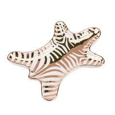 a zebra print starfish shaped plate on a white background with gold trimmings