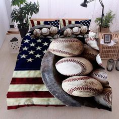 baseballs and american flag bedding in a room with a lamp on the side