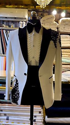 a white tuxedo jacket with black details on the lapel