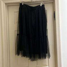 Black With Sheer Layer On Top. Great For Over Leggings Or Dressing Up With A Blazer. Size M Black Tiered Tulle Skirt, Black Skirted Bottoms For Spring, Black Tulle Bottoms For Night Out, Black Tiered Skirt For Spring, Chic Black Bottoms With Tulle Skirt, Black Skirt With Elastic Waistband For Evening, Orange Midi Skirt, Blue Striped Skirt, Crinkle Skirt