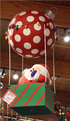 two large christmas balls suspended from the ceiling