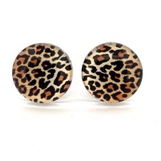 Fun and groovy retro disco style leopard print glass earrings.  Modern stock. They feature a very retro leopard print design! Size is 12mm.  Set on surgical steel post with butterfly clutch. Please keep me dry. I will last longer that way!  10% of all sales (excluding international postage) will be donated to PLAN International Australia I will update total donated for each month in shop information. Tortoiseshell Round Earrings For Gift, Round Tortoiseshell Earrings For Gift, Trendy Leopard Print Earrings As Gift, Adjustable Leopard Print Earrings For Gift, Pokemon Earrings, Disco Style, Retro Disco, Butterfly Clutch, Groovy Retro