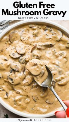 a bowl of gluten free mushroom gravy with a spoon in it