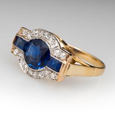 This stunning circa 1930s antique ring features a semi-bezel set, round cut center sapphire, two baguette cut side sapphires, and 18 bead set, round single cut accent diamonds. The ring measures 11.4mm at the top, rises 5.5mm above the finger, tapering to 2.0mm wide and 0.8mm thick at the base of the shank. The ring is currently a size 7. The sapphires show gentle abrasion and the ring overall is in great shape. Art Deco Round Sapphire Gemstone Ring, Art Deco Multi-stone Oval Sapphire Ring, Art Deco Oval Multi-stone Sapphire Ring, Art Deco Round Sapphire Diamond Ring, Art Deco Sapphire Ring With Baguette And Brilliant Cut, Vintage Blue Sapphire Ring With Bezel Setting, Classic Multi-stone Sapphire Ring With Baguette Cut, Vintage Sapphire Gemstone Diamond Ring, Timeless Multi-stone Sapphire Ring