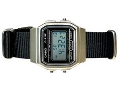 This retro Casio in stock form is already cool, functional, affordable, and accurate-- but with some magic from RLSWW, it's made even cooler-- with a ballistic nylon strap to match your personality. In addition-- you may select the option to modify the screen color to further reflect your tastes and bring some color to your wrist. Note, this is a permanent modification to the screen, not the LED backlight. It will be colored in all light conditions :) Please note: This is a permanent modificatio Retro Black Analog Watch Accessories, Retro Black Analog Watch, Black Retro Analog Watch, Retro Black Analog Watches, Retro Black Watch With Stopwatch, Vintage Black Watch With Stopwatch, Vintage Black Digital Watch With Stopwatch, Vintage Black Digital Watch With Analog Display, Vintage Black Outdoor Watches