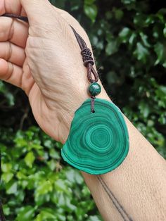 Dear Fellow Light Beings 💜 .  I Have Made This Stunningly Beautiful Genuine Malachite Pendant from a Sliced Piece of Malachite, 9mm Bead and Cord You will Get This Exact Necklace which in total weighs 29g Size is   36mm x 44mm x 7mm thick Supplied In an Organza Bag and Gift Wrapped Plus Sent in a Postal Box  The Cord gives a 12 inch drop but is adjustable with the slip band as shown Malachite is said to be an Important Protection Gemstone.  Malachite is said to Clears and Activates the Chakras Light Beings, Malachite Crystal, Malachite Necklace, Malachite Pendant, Les Chakras, Bead Pendant, Adjustable Necklace, Natural Shapes, Heart Chakra