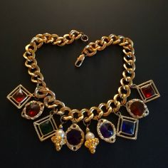 Very chic imposing vintage 80's NECKLACE, in gold metal with multicolored charms, good condition. Vintage Gold Multi-stone Necklace, Party Multicolor Charms Necklaces, Gold Metal Charm Necklaces With Jewels, Gold-tone Jeweled Metal Necklaces, Gold-tone Jeweled Metal Necklace, Gold-tone Jewel Necklace In Metal, Gold-tone Metal Necklace With Jewels, Multicolor Jeweled Costume Jewelry Necklaces, Gold Multi-stone Costume Jewelry