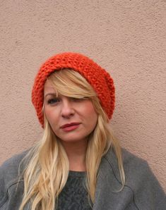 Hand Knitted Slouchy hat in juicy orange color. This hat is hand knitted from soft 80% acrylic and 20% wool yarn. Powerful Orange color for grey winter days.Other colors also available.One size fits all. Knitted in circular needle without visible seam. Fashion, cozy, winter fashion. Nice colour easy to combine with any other color.Hand wash and dry flat.Chunky Knitted Hats by EllenaKnits.Winter Hat / Slouchy Beanie / Slouchy Hat / Women Hat / Chunky Knit Hand Knitted Crochet Hat For Fall, Hand Knitted Crochet Hat For Fall, One Size, Hand Knitted Brimmed Beanie For Fall, Winter Orange Hat, Winter Orange Hat, One Size Fits Most, One Size Orange Winter Hat, Orange Beanie For Winter, Hand Knitted Slouchy Hat For Fall, Casual Orange Crochet Beanie Hat