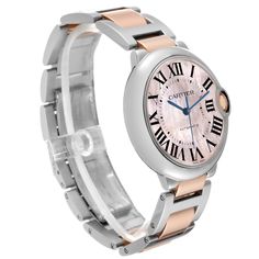 Cartier Ballon Bleu Steel Rose Gold Mother Of Pearl Ladies Watch W6920033. Automatic self-winding movement. Round stainless steel case 36 mm in diameter. Fluted 18K rose gold crown set with a blue spinel cabochon. Stainless steel smooth bezel. Scratch resistant domed sapphire crystal. Pink mother of pearl dial with black Roman numerals. Blued-steel sword shaped hands. Secret Cartier signature at VII. Stainless steel and 18k rose gold bracelet with double deployant clasp. Fits 6 1/4" wrist. Rose Gold Watch With Metal Dial For Anniversary, Rose Gold Watches With Metal Dial For Anniversary, Cartier Watch Accessories With Skeleton Dial, Rose Gold Watches With Skeleton Dial, Rose Gold Watch Accessory With Skeleton Dial, Classic Pink Round Watch, Rose Gold Watch Accessories With Subdials And Round Dial, Pink Round Watches With Subdials, Rose Gold Watch Accessories With Subdials