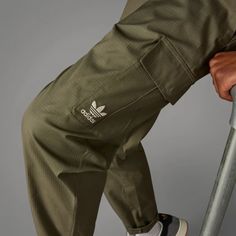 adidas Enjoy Summer Cargo Pants - Green | Men's Lifestyle | adidas US Adidas Functional Outdoor Bottoms, Adidas Functional Bottoms For Outdoor Activities, Functional Adidas Bottoms For Outdoor Activities, Relaxed Cotton Adidas Pants, Cotton Relaxed Fit Pants With Adidas Logo, Adidas Cotton Joggers For Streetwear, Adidas Logo Cotton Joggers For Streetwear, Adidas Cotton Bottoms For Streetwear, Adidas Relaxed Fit Pants With Logo