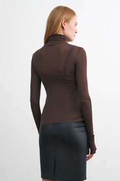 Meet our favorite multi-tasking silhouette, the Eloise Sheer Turtleneck. She features several signature Marcella details—including thumbhole sleeves and extra length around the torso. Crafted from our European sheer jersey for an ultra-light feel and body-loving fit, Eloise is casual yet easy to dress up—a true staple. Eloise is also available separately in our non-sheer Tencel jersey. [SPLIT] Emmy, in espresso, is 5'10.5" (179 cm), wearing size XS. Maritza, in black and in red, is 5'9.5" (177 c Sheer Turtleneck, Sweatshirt Fabric, Turtle Neck Top, Multi Tasking, Sheer Top, Light Beige, Tunic Dress, Jumpsuit Dress, Espresso