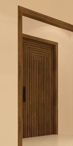 an empty room with a wooden door and mirror